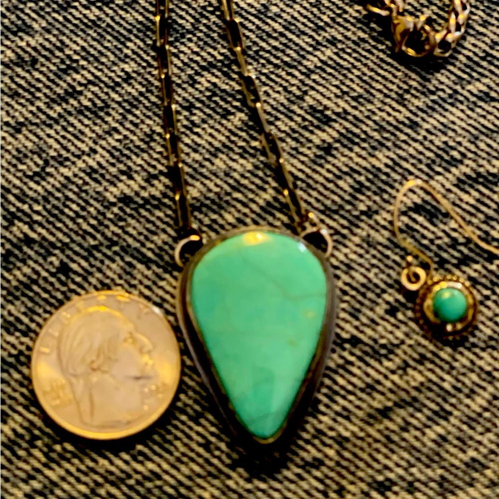 Genuine turquoise and sterling silver in a gun metal chain.